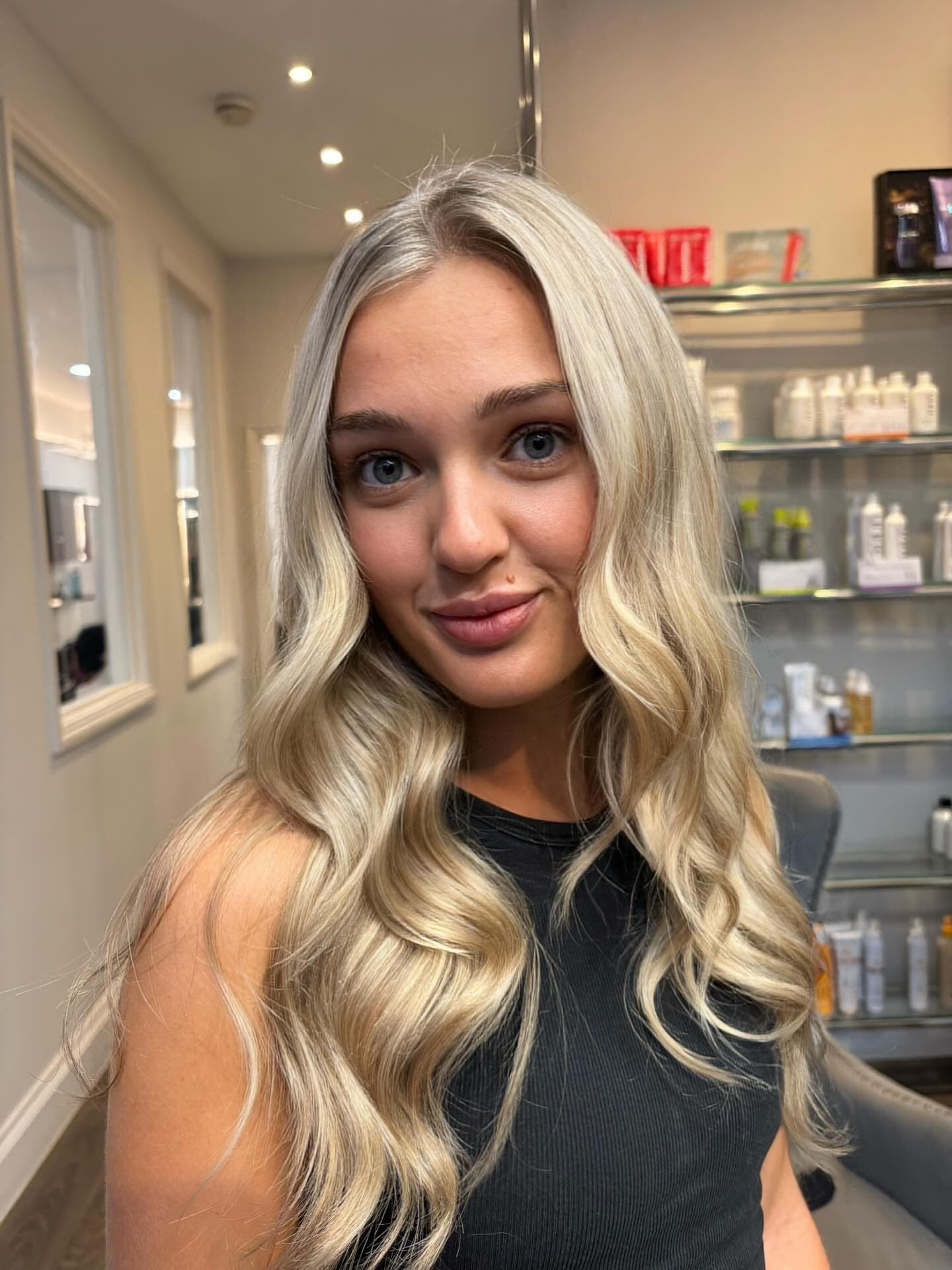 Long blonde highlights, waved and finished in the salon