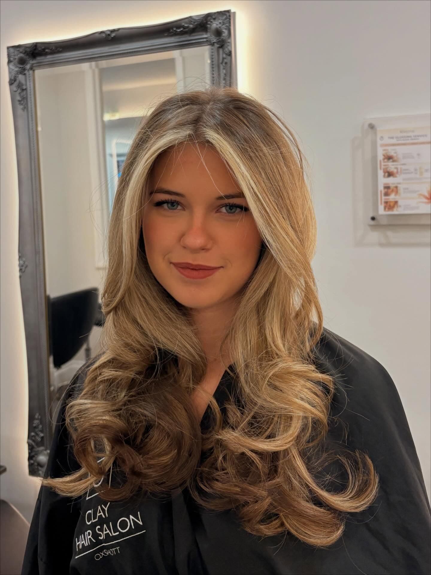 Long blonde waves after colour and a blow dry, from the Clay Instagram feed