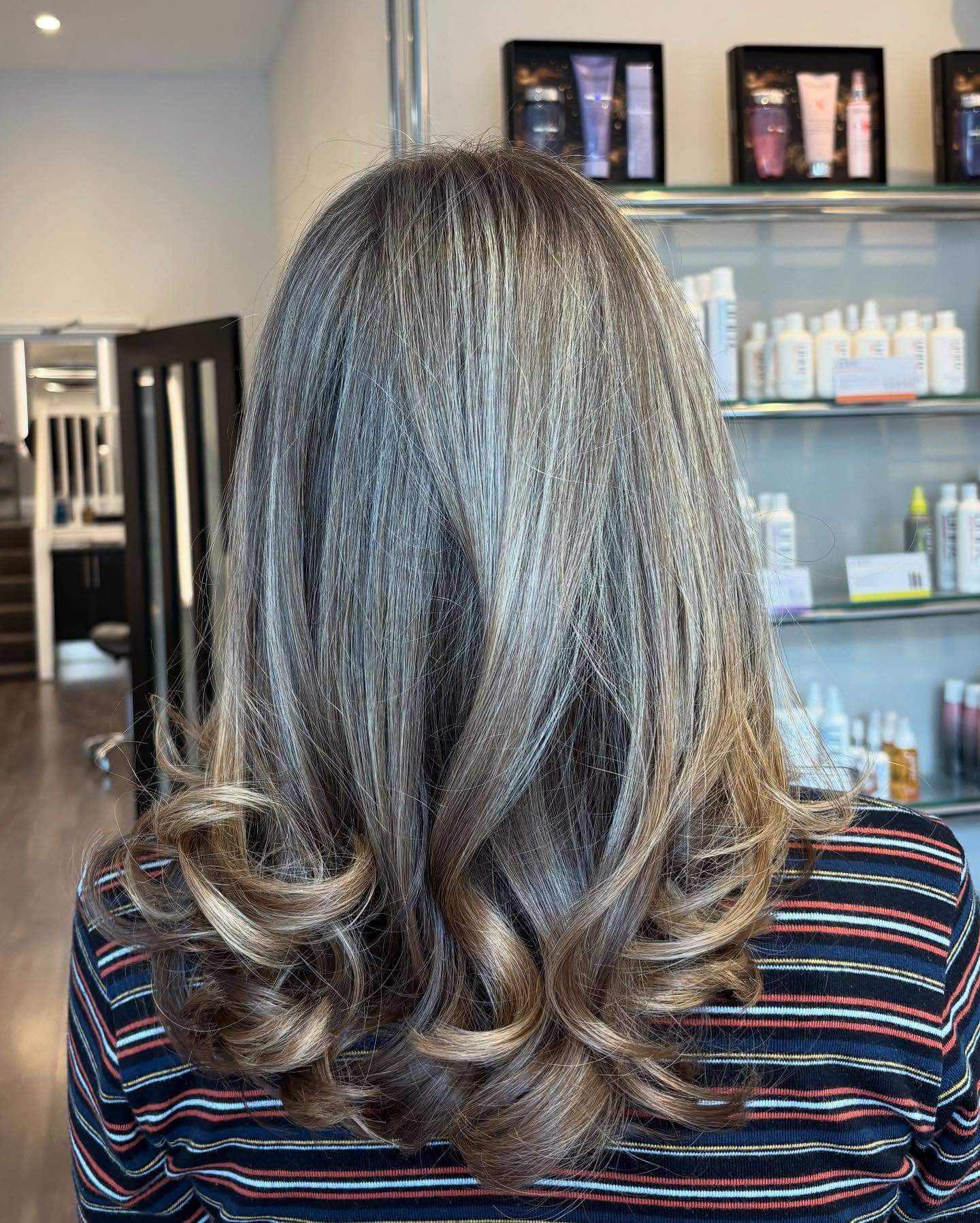 Lived-in bronde balayage, waved and finished, from the Clay Instagram feed